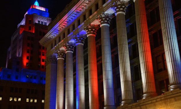 We Need Each Other: Downtown Milwaukee buildings illuminate the darkness with beacons of hope