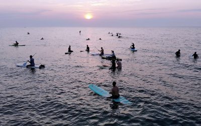 Waveriders greet the summer sunrise with “Wiloha” surf culture