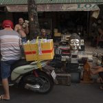 Overflowing landfills: How shops at one sprawling market in Vietnam work to recycle E-waste